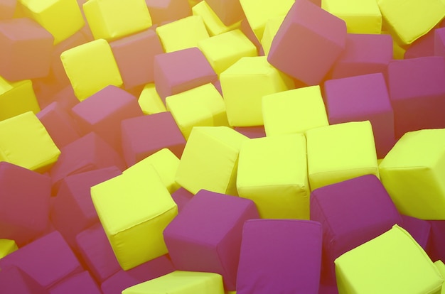 Many colorful soft blocks in a kids' ballpit at a playground