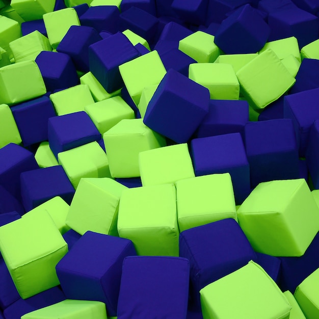 Many colorful soft blocks in a kids' ballpit at a playground