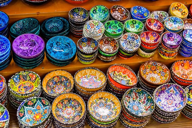 Many colorful souvenir plates for sale at the bazaar in Turkey