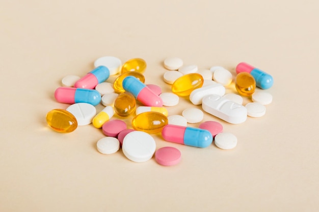 Many different colorful medication and pills perspective view Set of many pills on colored background