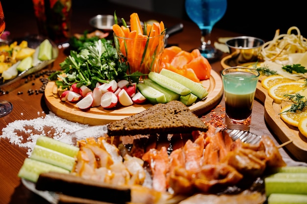 Many different delicious dishes on the table. Various snacks and antipasti on the table. Restaurant menu.