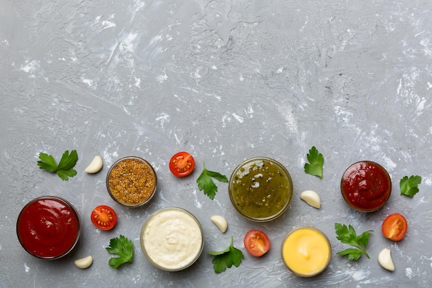 Many different sauces and herbs on table flat lay top view sauces with spices healthy concept