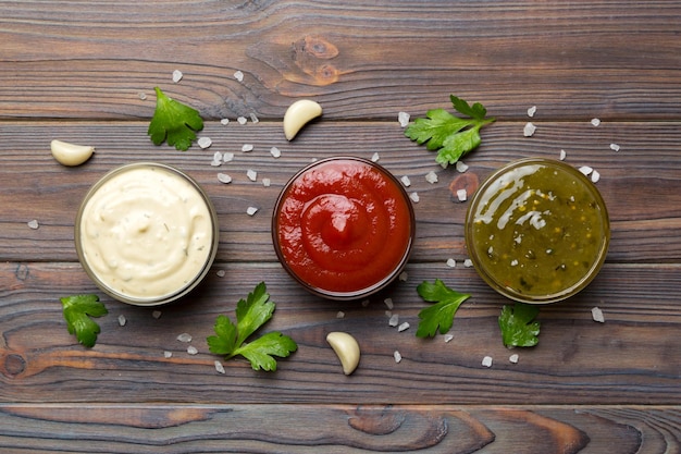 Many different sauces and herbs on table flat lay top view sauces with spices healthy concept