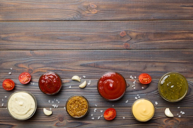 Many different sauces and herbs on table flat lay top view sauces with spices healthy concept