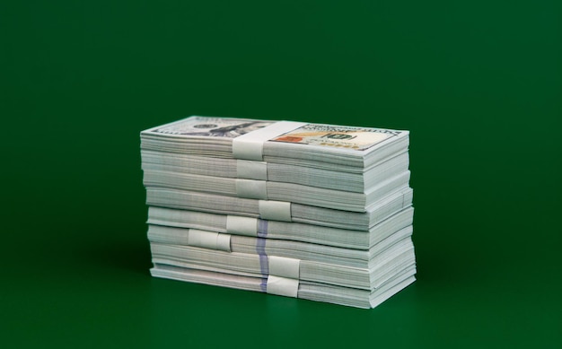 Many dollars stacked together Earnings from work salaries investments financial loans mutual funds banknotes dollars