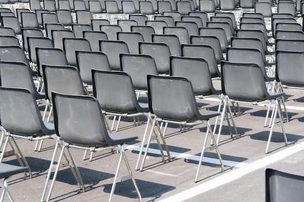 Many empty chairs without audience