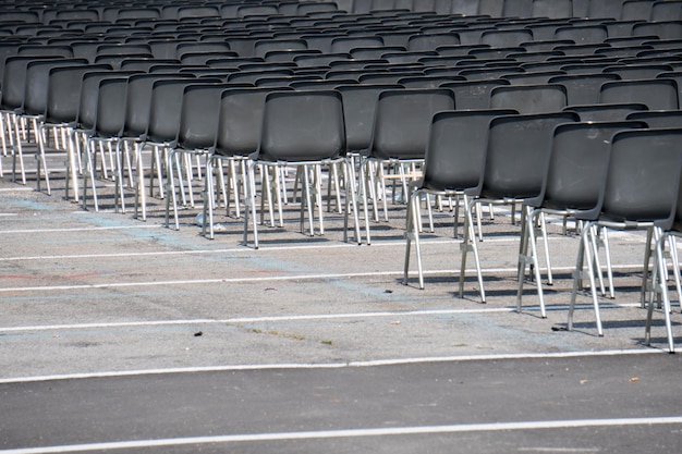 Many empty chairs without audience