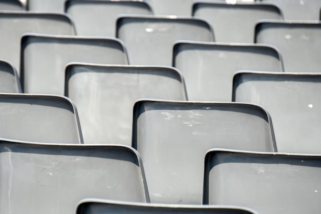 Many empty chairs without audience