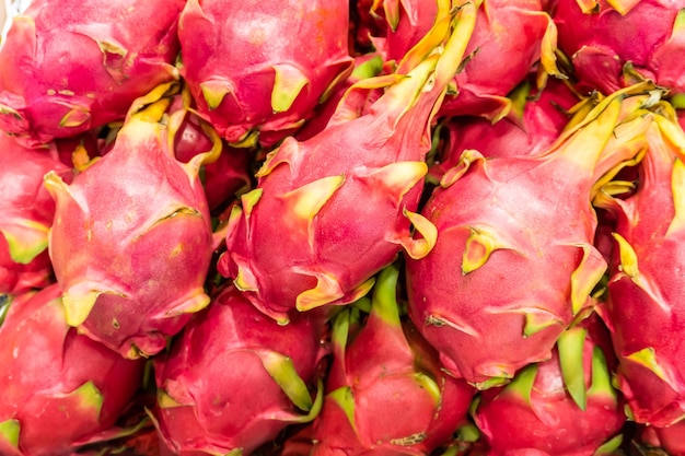 Many fresh dragon fruit lined up in the background.Many fresh dragon fruit lined up in the background.