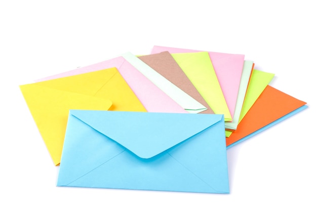 Many multicolored postal envelopes on a white isolated background. mail concept