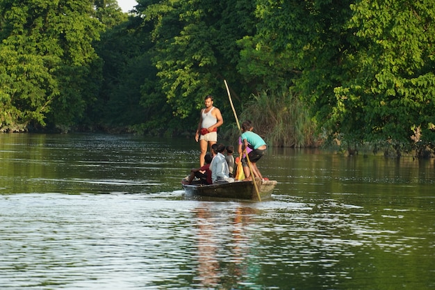 Many people riding the boat in the river