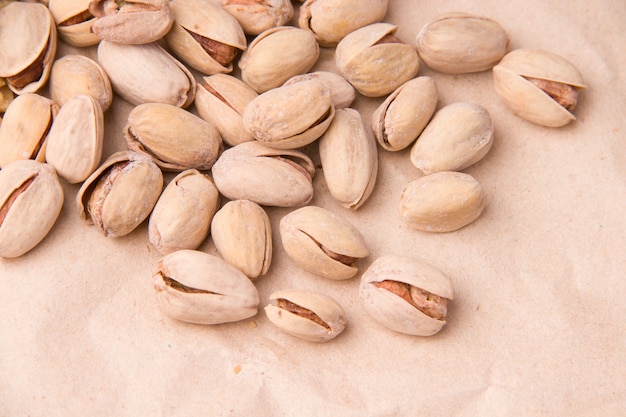 Many pistachios close-up on paper