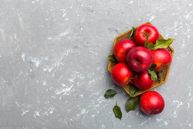 Many red apples on colored background top view Autumn pattern with fresh apple above view with copy space for design or text