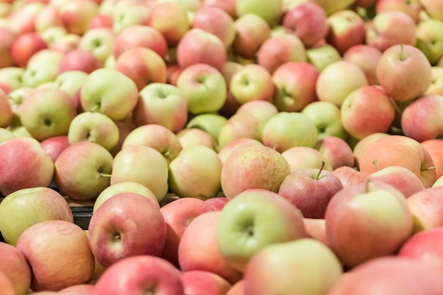 Many red and green apples stretching into the distance as a background