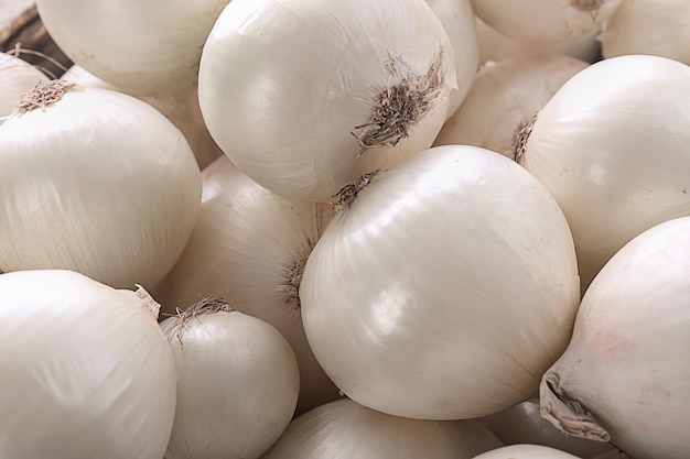 Many ripe onions as background closeup