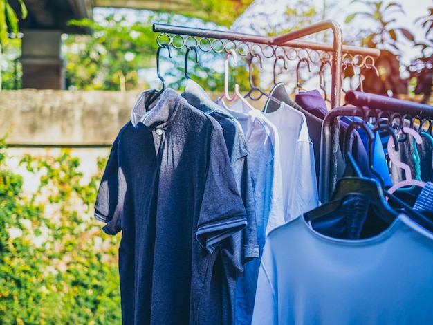 Many shirts hanging on clothesline