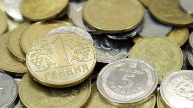 Many Ukrainian coins. National currency. Business concept. Ukrainian pennies. The concept of denomination of new and withdrawal of old coins.