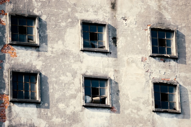 Many windows on the facade of the old building. Monotone architecture