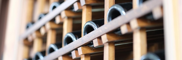 Many wine bottles in wine cellar closeup