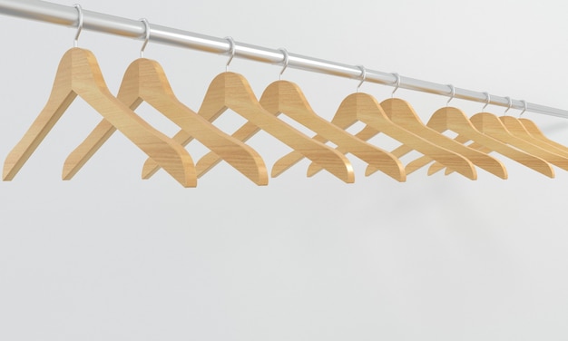 Photo many wooden hangers on a bar isolated on a white background concept of shopsalebusiness fashion