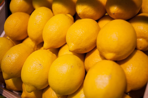 many yellow lemons Healthy fruits lemon fruits background many lemon fruits in store