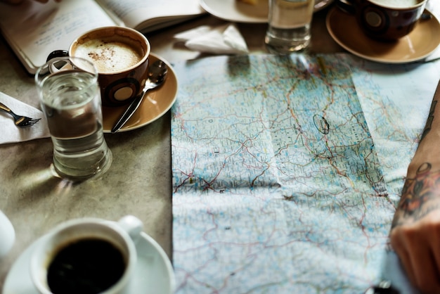 A map and some coffee cups