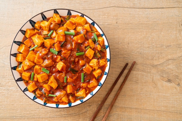 Mapo Tofu - The traditional Sichuan dish of silken tofu and ground beef, packed with mala flavor from chili oil and Sichuan peppercorns - Asian food style