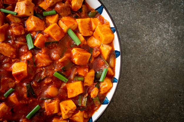 Mapo Tofu The traditional Sichuan dish of silken tofu and ground beef packed with mala flavor from chili oil and Sichuan peppercorns