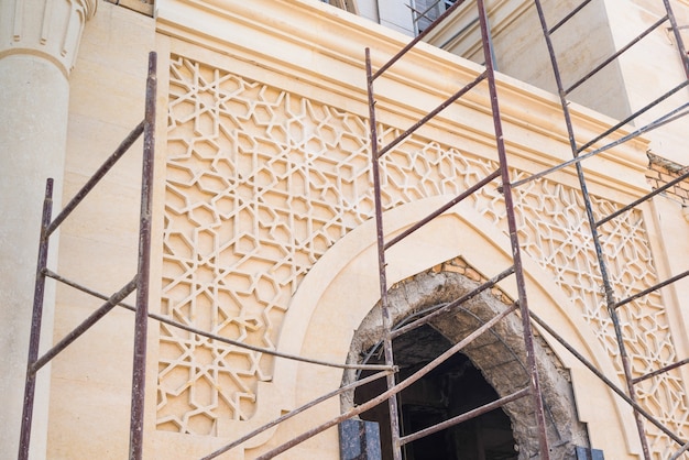 Marble arch of a building under construction, details