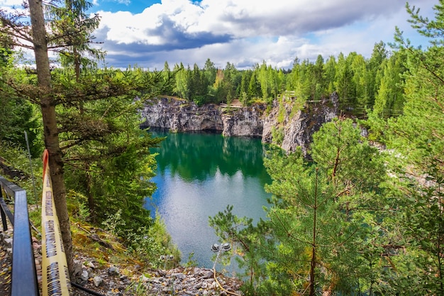 Marble canyon in Ruskeala Natural mountain park On the protective tape is written in Russian Caution