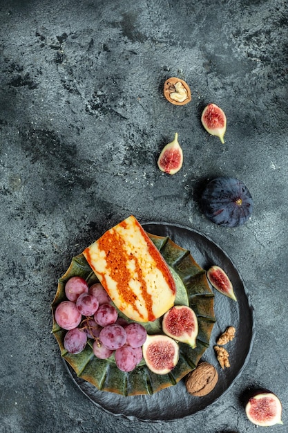 Marble delicous cheese served figs grapes and walnuts banner menu recipe place for text top view