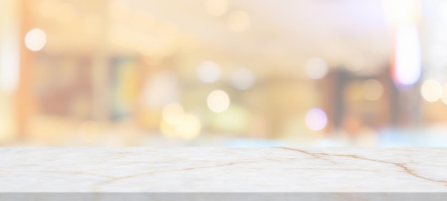 Marble table top with blurred abstract cafe restaurant interior background