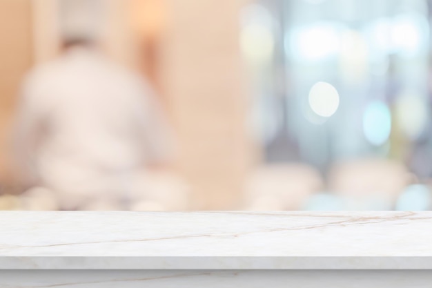 Marble table top with blurred kitchen cafe restaurant interior background