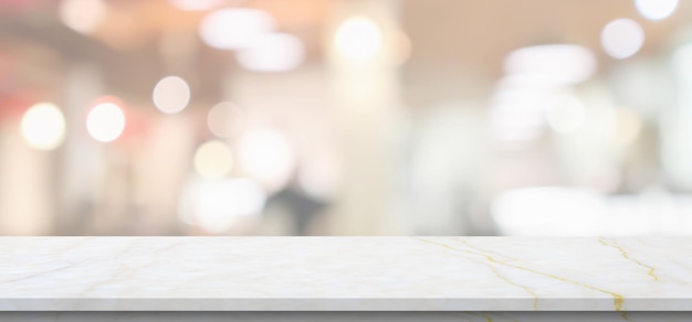 Marble table top with blurred kitchen cafe restaurant interior background