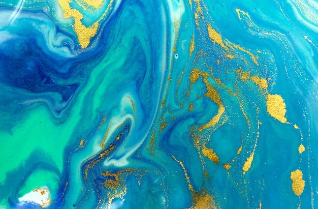 Marbled blue and gold abstract background. Liquid marble pattern.