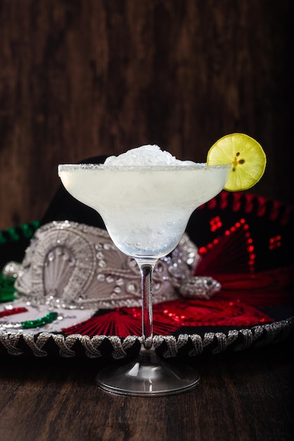 Margarita cocktail and mariachi hat in the background Mexican symbols