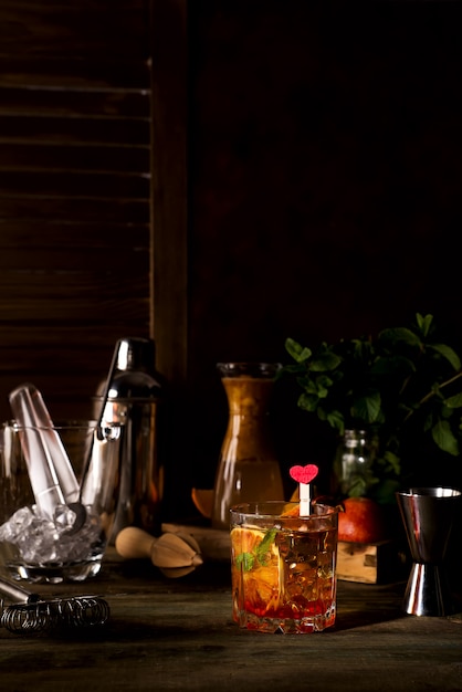 Margarita coctail with ice and mint on wooden background