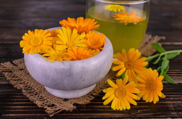 Marigold flowers and calendula tea.Selective focus.