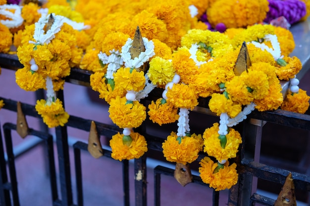 Marigolds flowers at the Erawan Shrine. Thao Maha Phrom Shrine is a Hindu shrine in Bangko