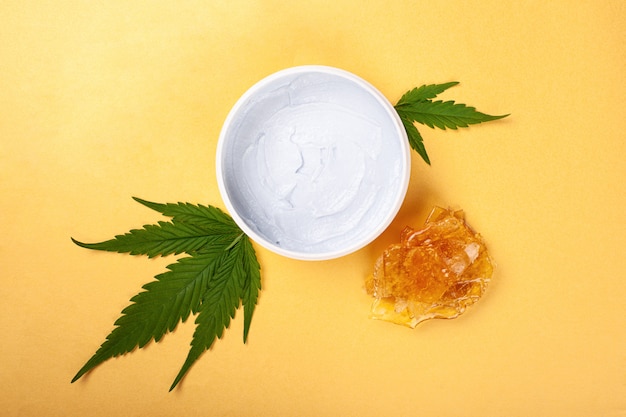 Marijuana cream with golden cannabis wax.beauty, alternative skin care.