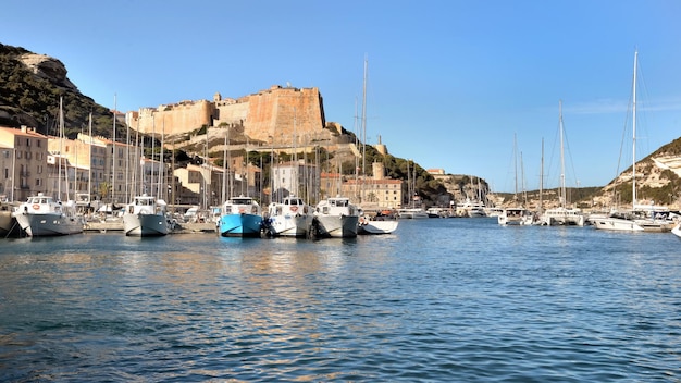 Marina of Bonifacio in Corsica island, and the ramparts in the background