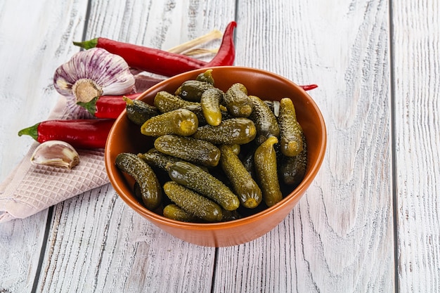 Marinated small cucumbers cornichon in the bowl