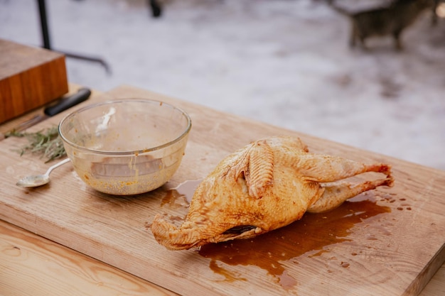 Marinated whole chicken in lemon juice with herbs