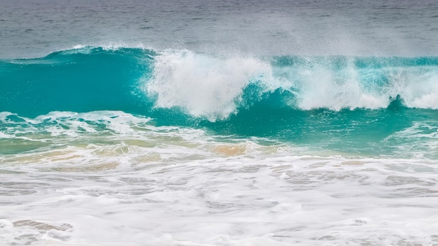 Marine background Powerful ocean blue waves with white foam