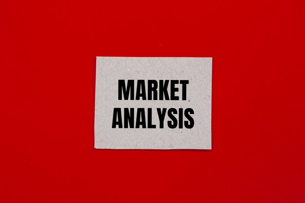 Photo market analysis message written on paper piece with red background conceptual market analysis symbol copy space