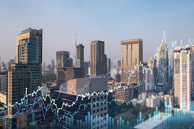 Market behavior graph hologram sunset panoramic city view of Bangkok popular location to achieve financial degree in Southeast Asia The concept of financial data analysis Double exposure