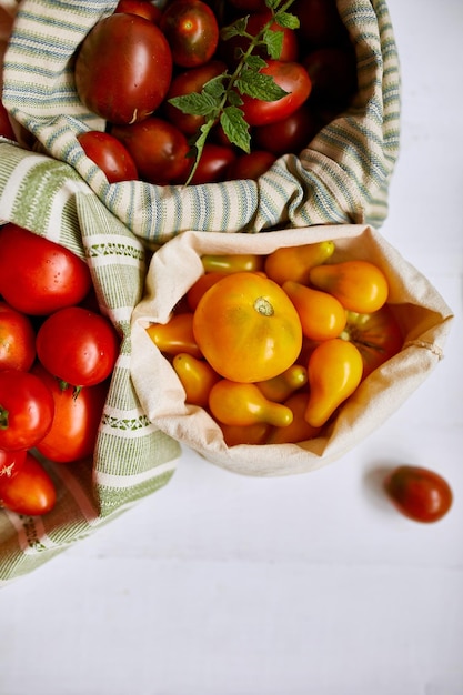 Market delivary of Different kinds of tomatoes in eco textile bag Zero waste