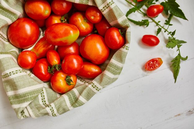 Market delivary of red tomatoes in eco textile bag zero waste