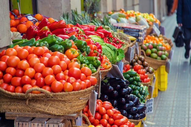 Market stalls with vegetables and fruits. Selective focus.