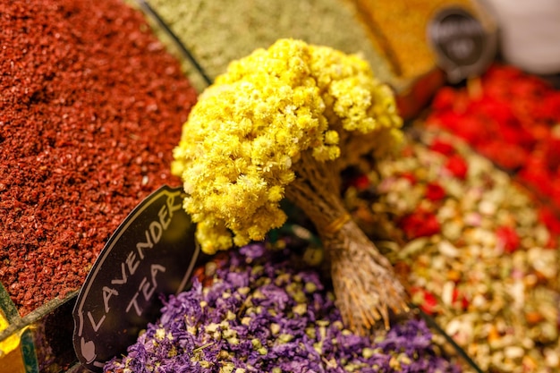 Market with different types of tea herbs plants and dried flower